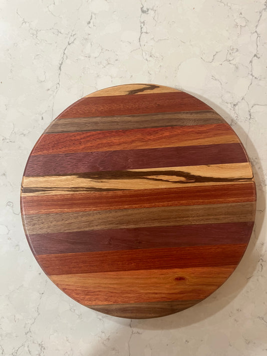 12” Lazy Susan made from exotic woods. Protective rubber feet on the bottom of the swivel to protect your table top or countertop.